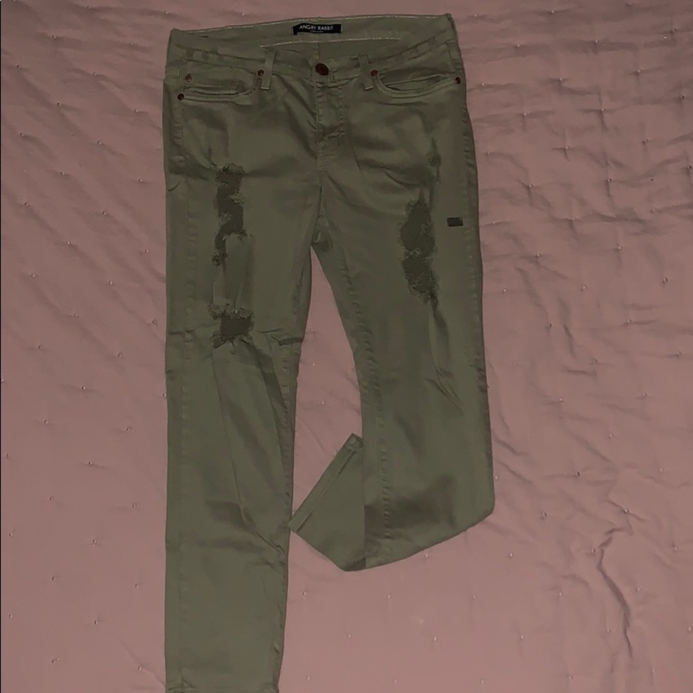 Olive green ripped jeans.